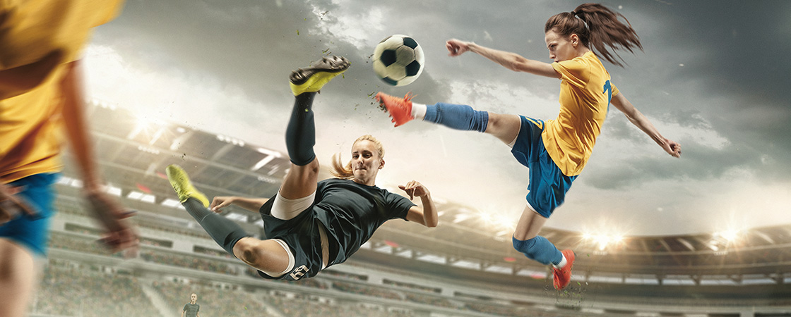 Soccer players in a stadium versing each other