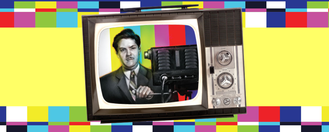 A vintage television set displays a man in a suit at a microphone against a color test pattern